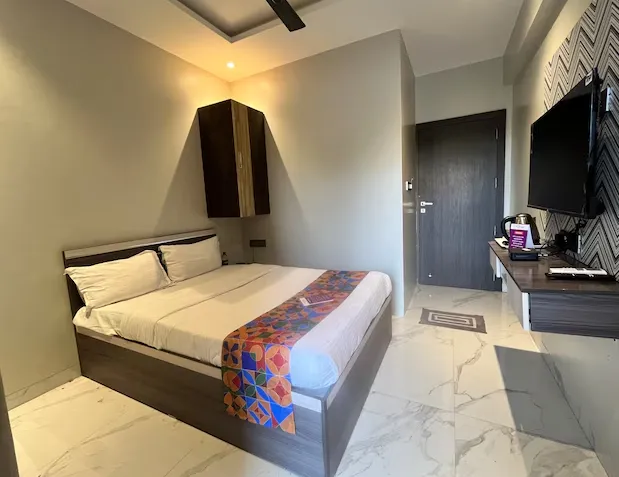 Deluxe Room at VITS Select Kharadi Pune with wooden flooring and compact work desk