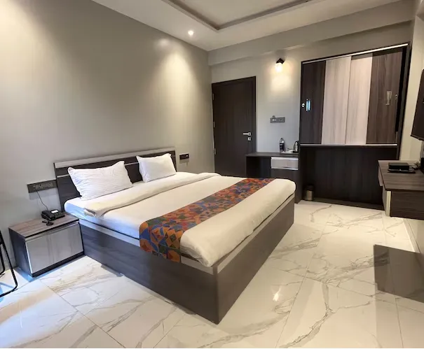 Deluxe Room at VITS Select Kharadi Pune with wooden flooring and compact work desk
