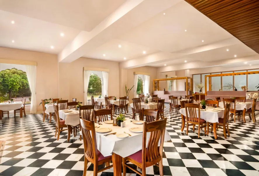 Restaurant at ZANA Forest Resort Ranthambore displaying dining tables and interior setting