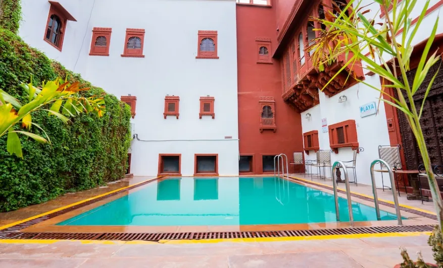Outdoor swimming pool at Zone Palace By The Park Phalodi with clear water and deck