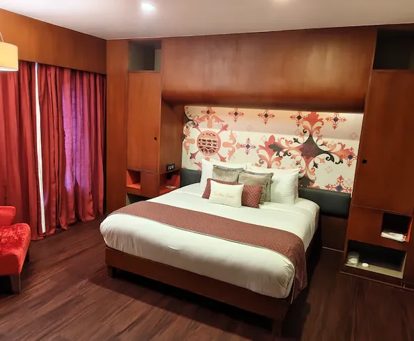 Family suite at Zone by The Park Hotel Chennai with separate seating and sleeping areas