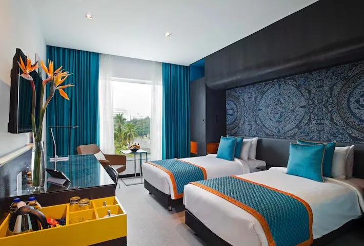 Zone Deluxe Room at Zone by The Park Hotel Coimbatore with seating area and work desk