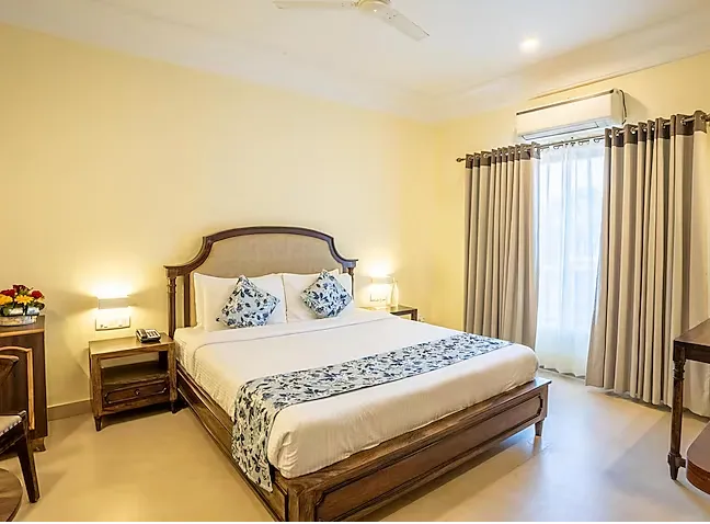 Deluxe room at jüSTa Alwar Bagh Resort Sariska Alwar featuring bed and window view