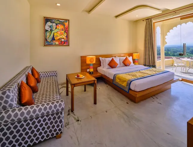 Guest room at Brij Bhoomi Resort, Nathdwara with bed, soft linens, and calming décor