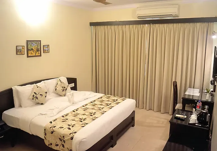 Deluxe room with large bed and contemporary décor at Calangute Towers - AM Hotel Kollection Goa