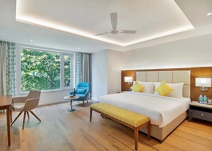 Deluxe room with spacious bed and contemporary décor at Golden Tulip Vagator Goa