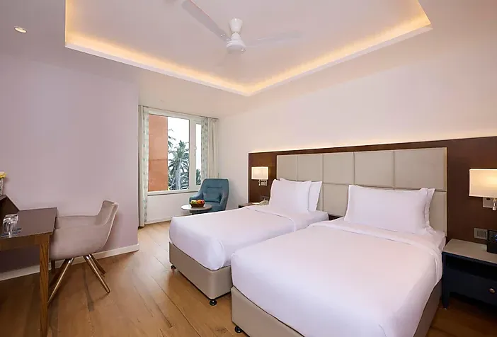 Superior room interior with modern bed arrangement at Golden Tulip Vagator Goa