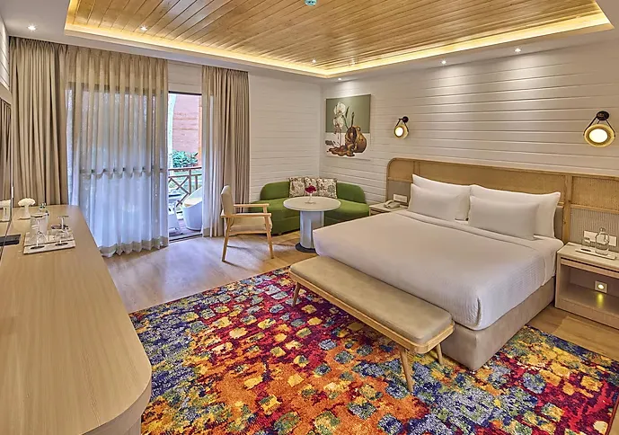 Royal-Orchid-Resort-wooden-cottages-with-balcony