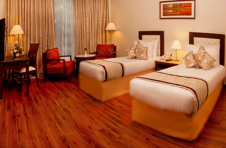 TreeHouse-Queens-Pearl-Gurugram-deluxeroom-twinbed